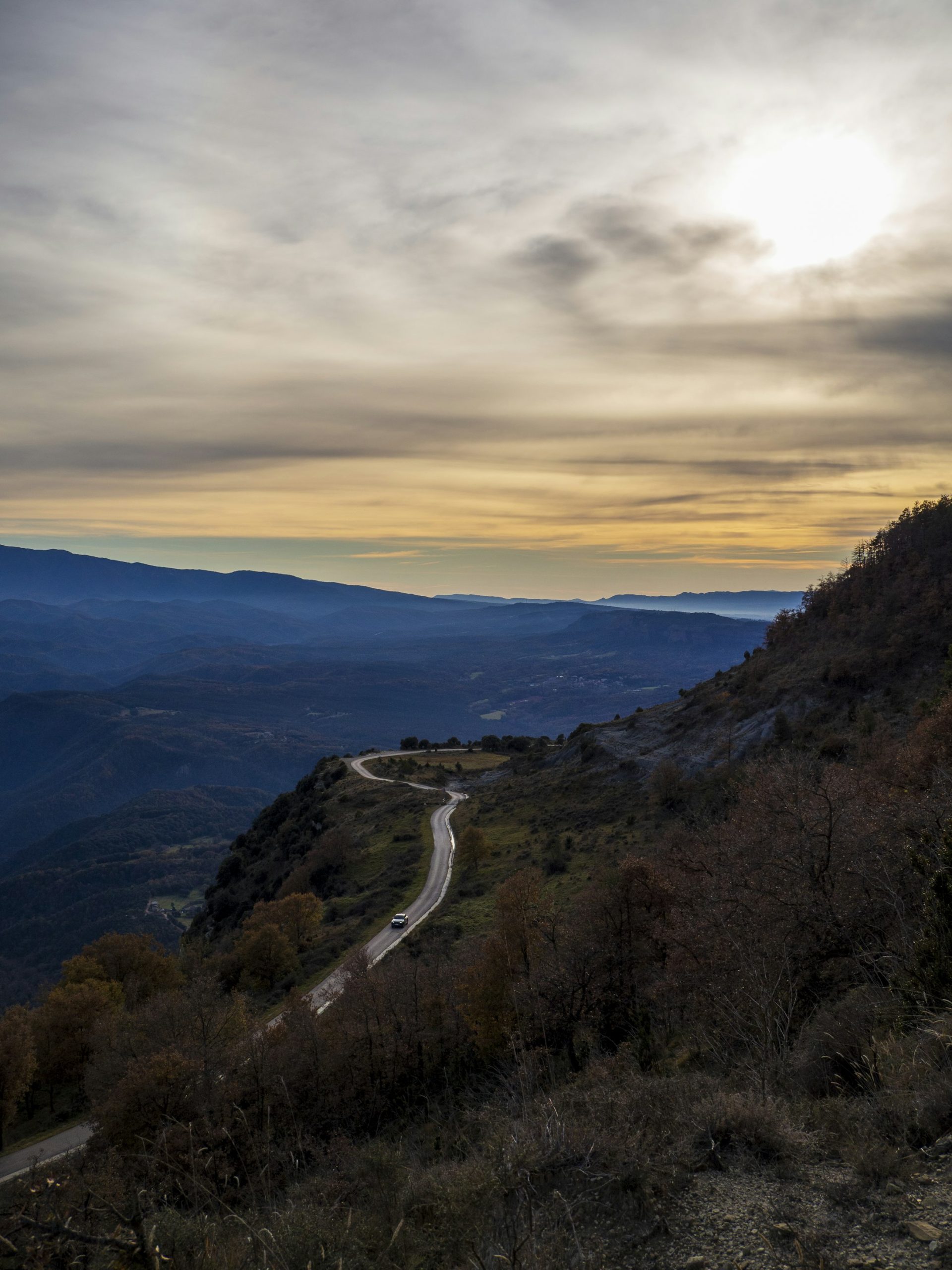 CTA — winding mountain road at dusk